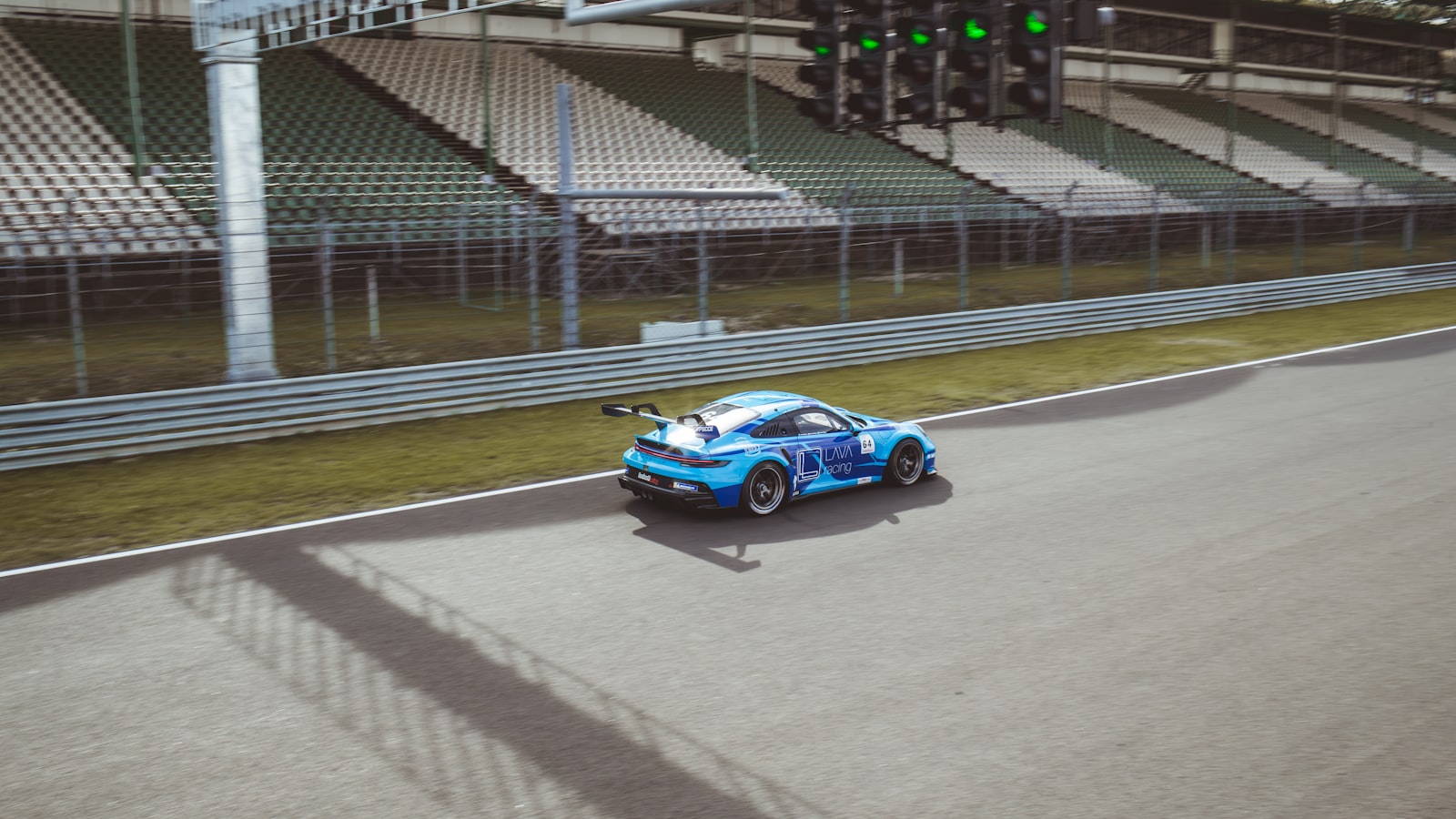 A pit lane and paddock at a road racing circuit